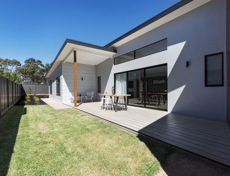 Outdoor entertaining deck and lawn of a contemporary new Australian home