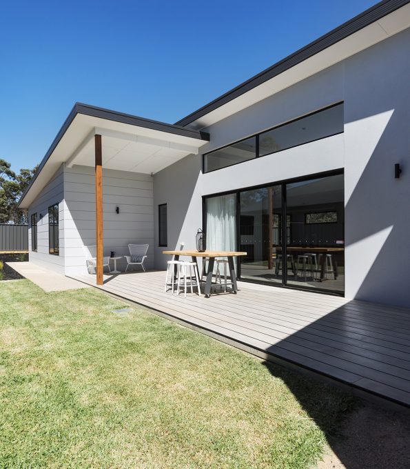 Outdoor entertaining deck and lawn of a contemporary new Australian home