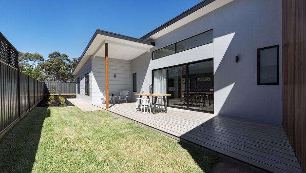 Outdoor entertaining deck and lawn of a contemporary new Australian home